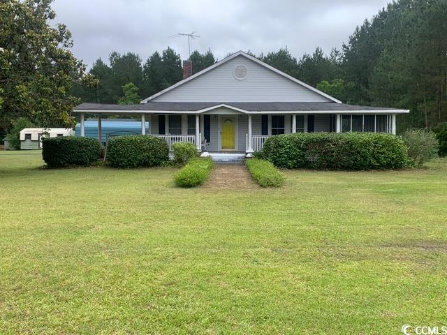 2100 Nesmith Road Nesmith, SC 29580 - Photo 1 of 37 Farmhouse inspired home with a chimney, covered porch, and a front lawn