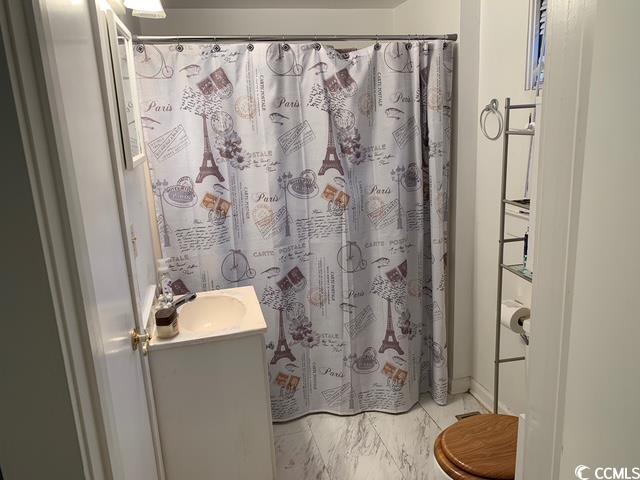 2100 Nesmith Road Nesmith, SC 29580 - Photo 19 of 37 Full bathroom featuring vanity, marble look tile flooring, a shower with curtain, and toilet