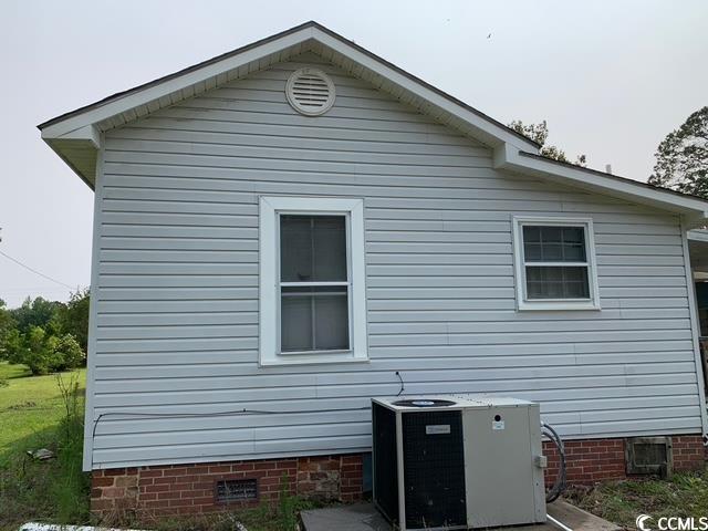 2100 Nesmith Road Nesmith, SC 29580 - Photo 22 of 37 View of side of property featuring crawl space and central AC unit