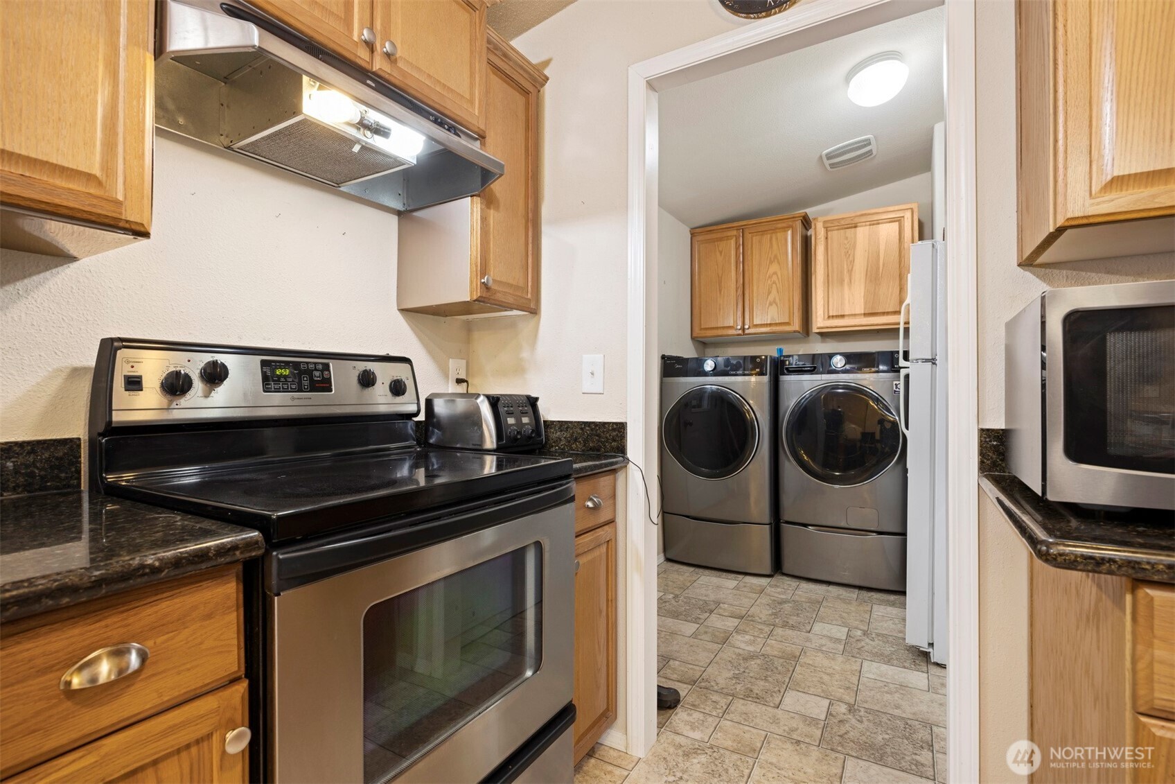 11027 Shuksan Rim Drive Deming, WA 98244 - Photo 13 of 39 a kitchen with a stove and a sink