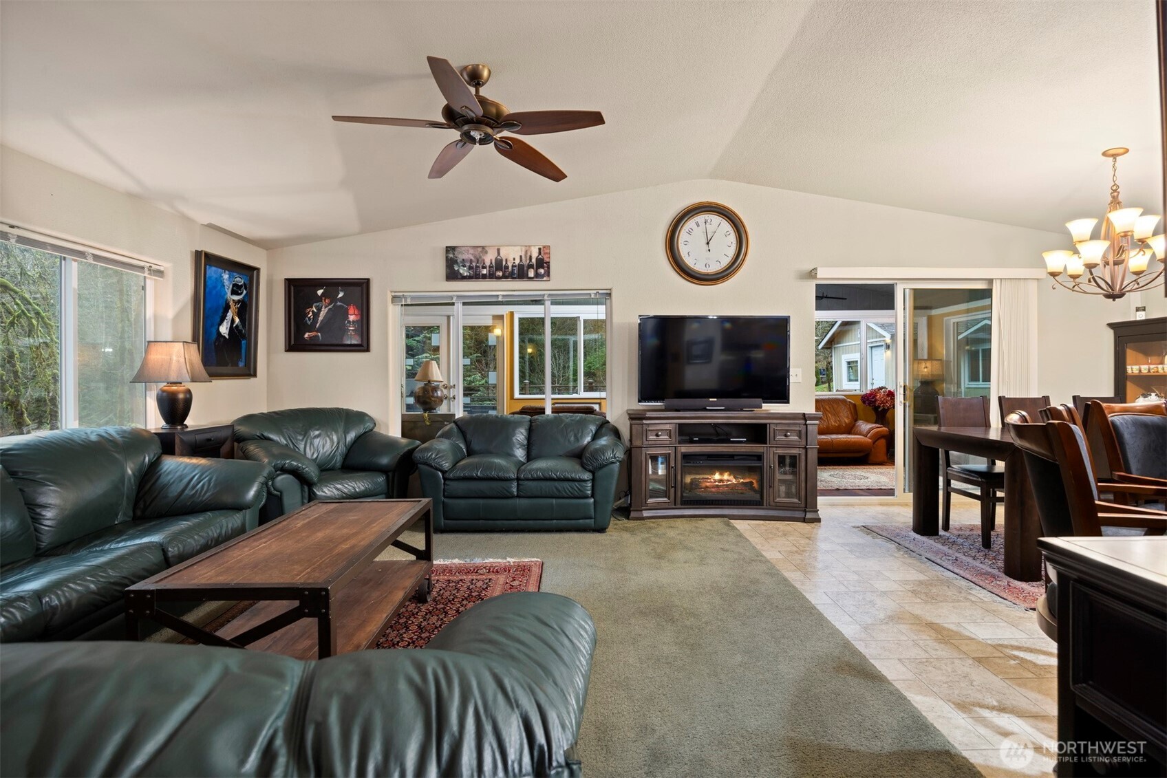 11027 Shuksan Rim Drive Deming, WA 98244 - Photo 18 of 39 a living room with furniture a flat screen tv and a window