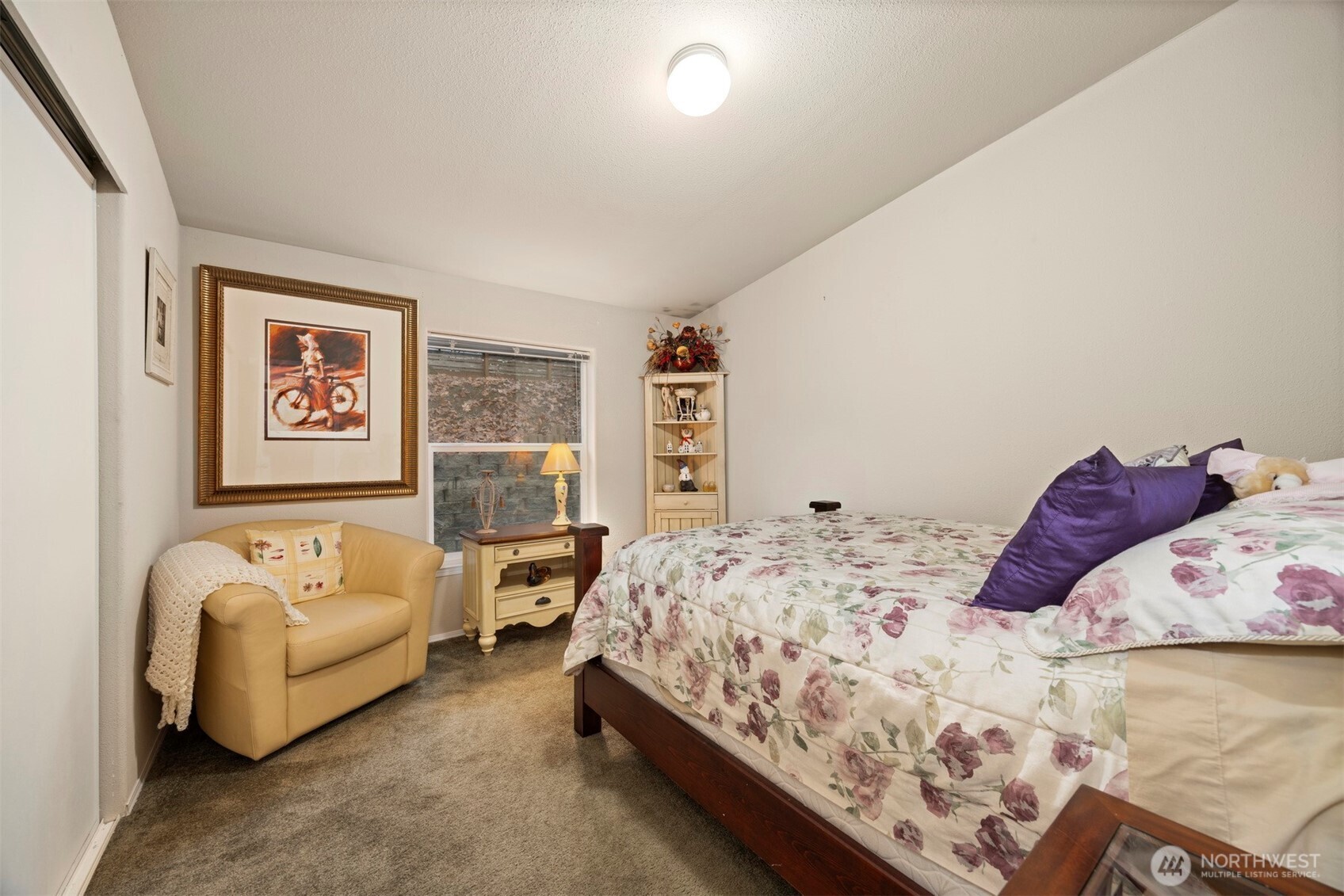 11027 Shuksan Rim Drive Deming, WA 98244 - Photo 22 of 39 a bedroom with a bed and couch