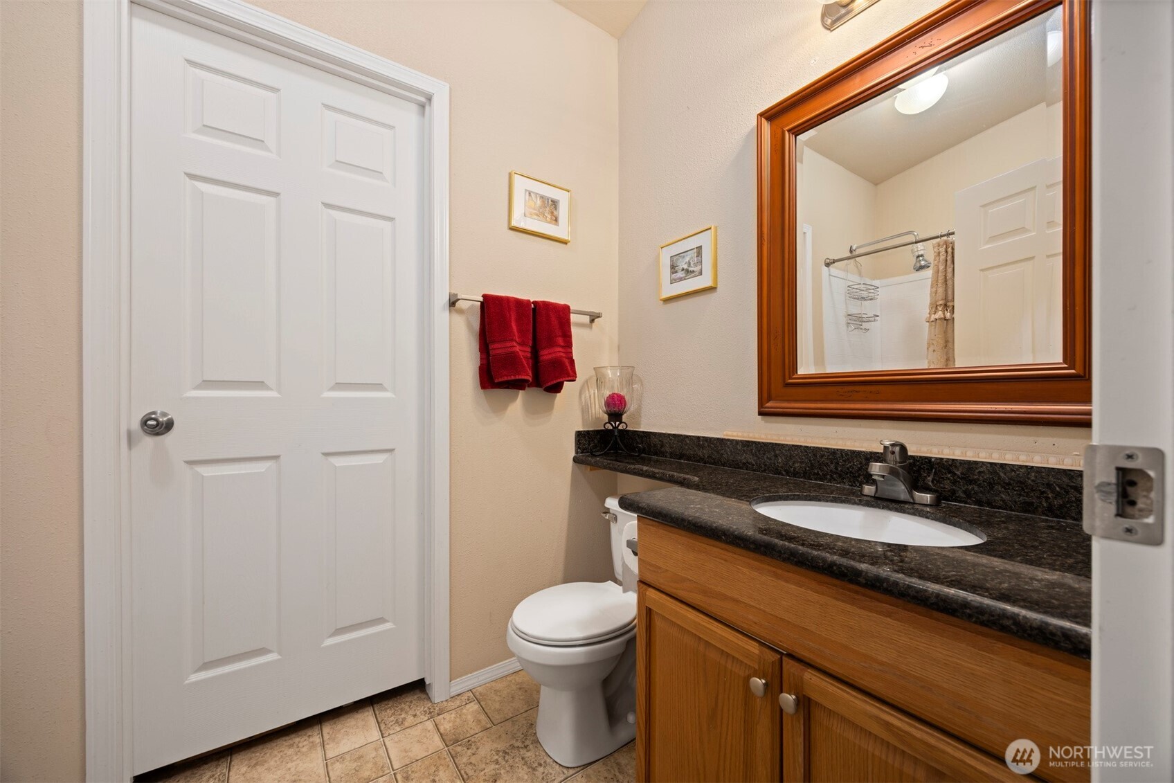 11027 Shuksan Rim Drive Deming, WA 98244 - Photo 24 of 39 a bathroom with a granite countertop sink toilet and mirror