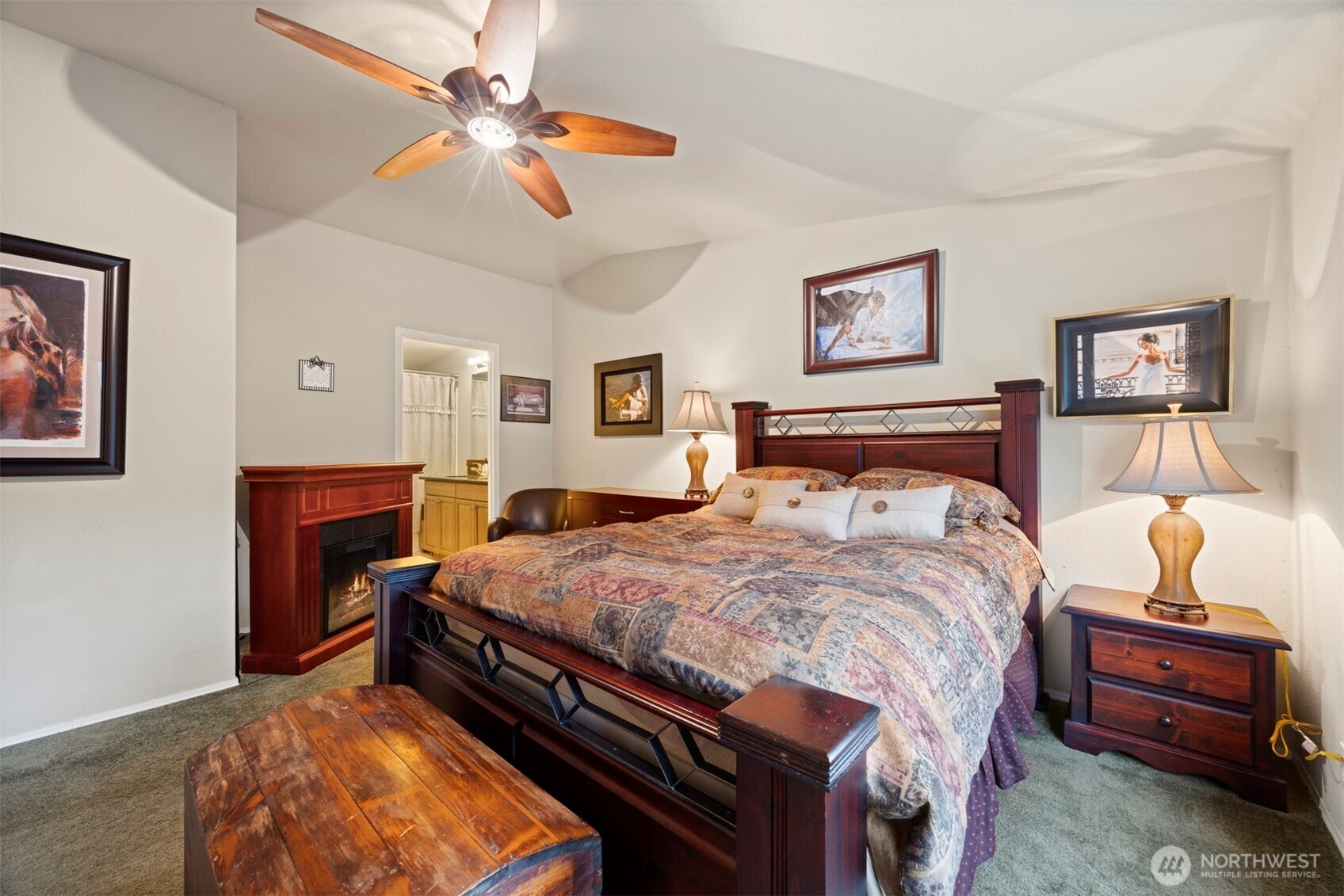 11027 Shuksan Rim Drive Deming, WA 98244 - Photo 26 of 39 a bedroom with bed and a chandelier