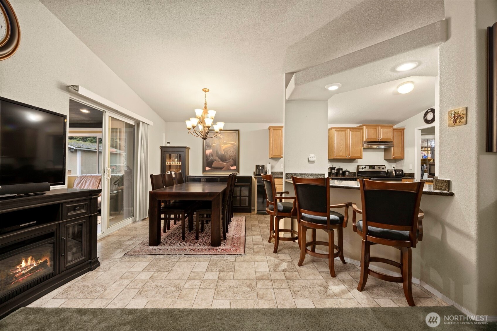 11027 Shuksan Rim Drive Deming, WA 98244 - Photo 9 of 39 a open kitchen view with a dining table chairs and refrigerator