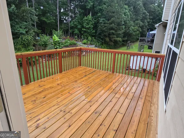 a view of balcony with wooden floor