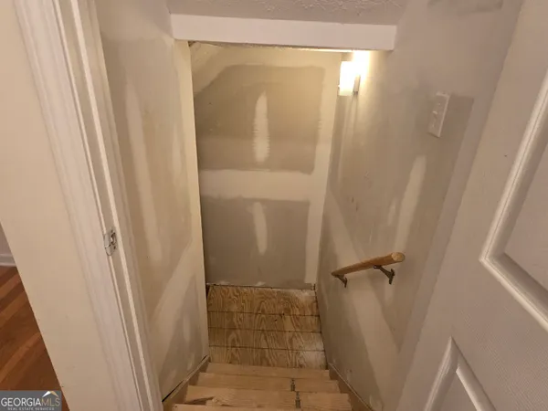a bathroom with a glass door shower and a sink