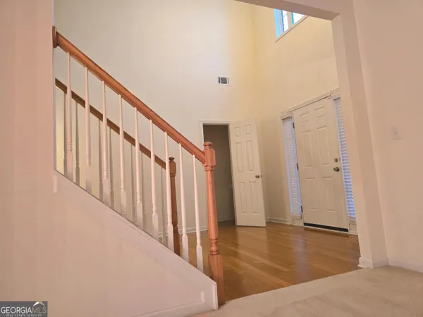 a view of an entryway with wooden floor