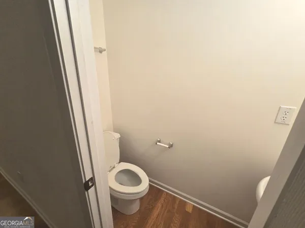 a white toilet sitting next to a sink