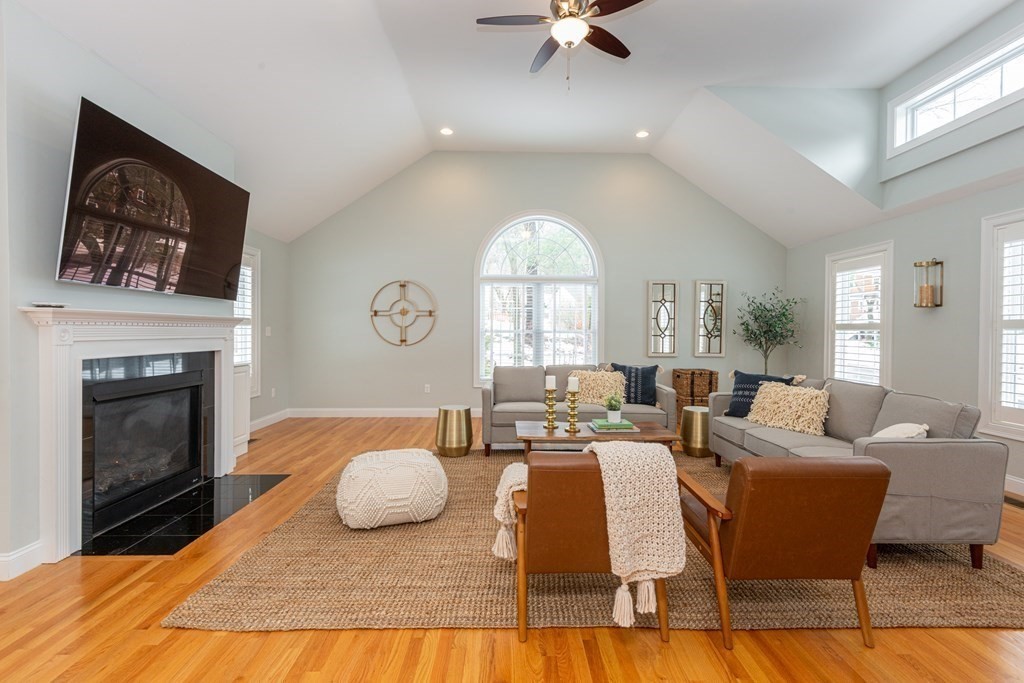 17 Pine Hill Road Lynnfield, MA 01940 - Photo 17 of 42 a living room with furniture a fireplace and a flat screen tv