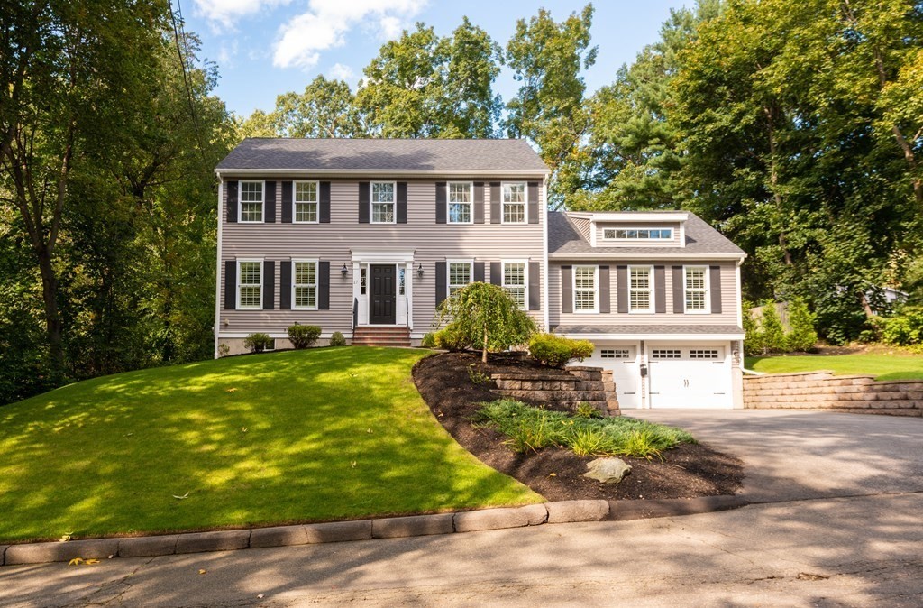 17 Pine Hill Road Lynnfield, MA 01940 - Photo 2 of 42 a front view of a house with garden