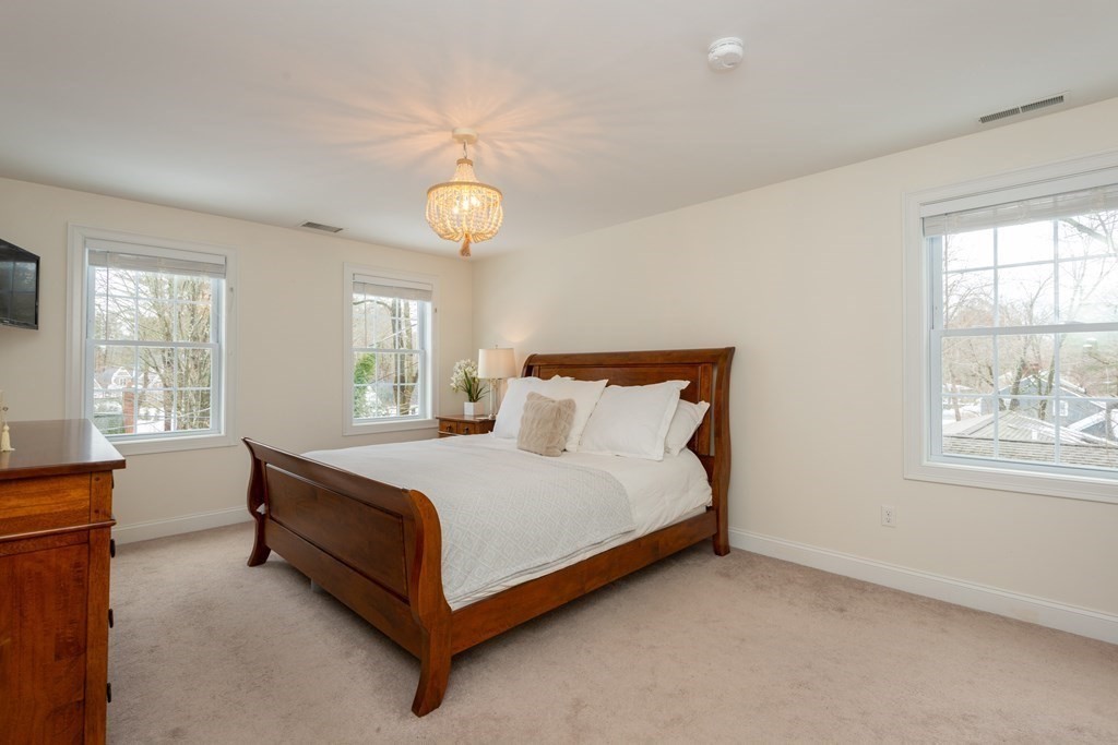 17 Pine Hill Road Lynnfield, MA 01940 - Photo 28 of 42 a bed sitting in a bedroom next to a window