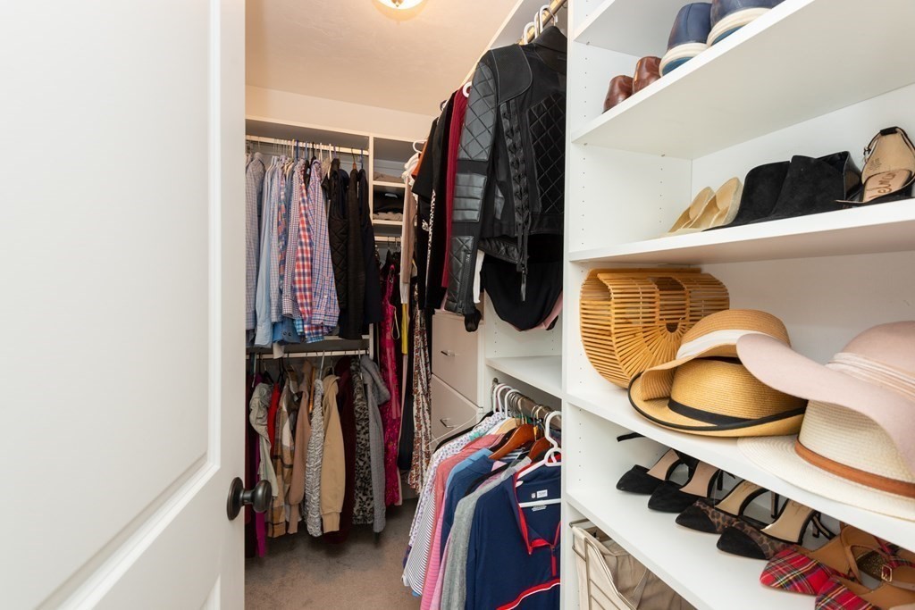17 Pine Hill Road Lynnfield, MA 01940 - Photo 31 of 42 a view of walk in closet with clothes and shoes
