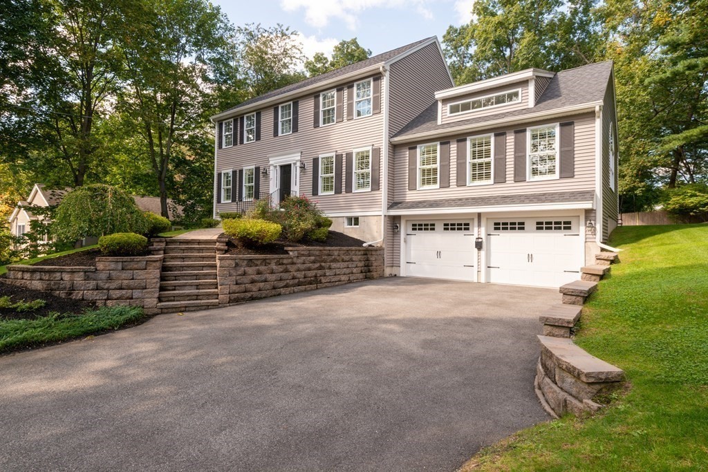 17 Pine Hill Road Lynnfield, MA 01940 - Photo 39 of 42 a front view of a house with garden