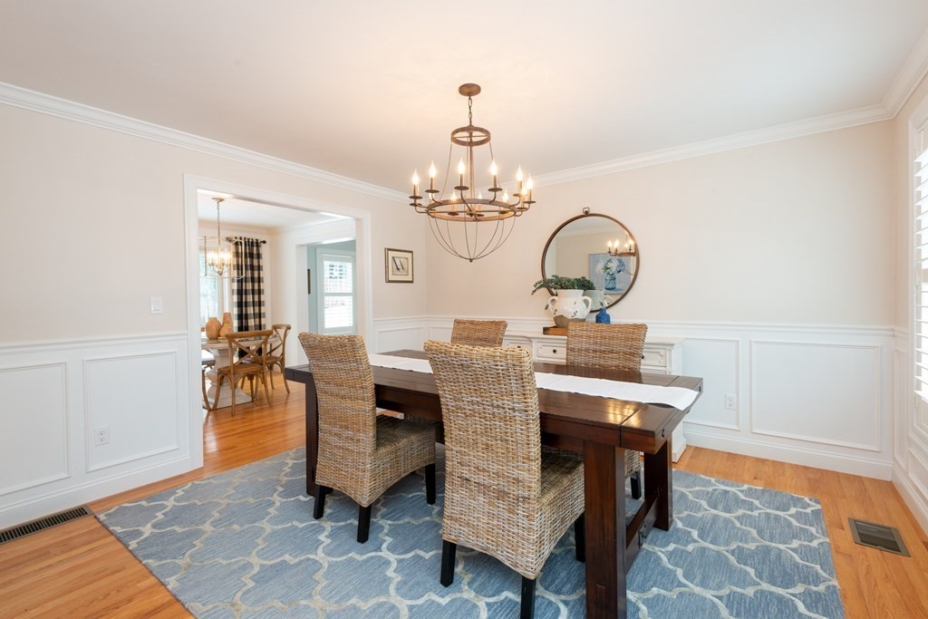 17 Pine Hill Road Lynnfield, MA 01940 - Photo 4 of 42 a view of a dining room with furniture and chandelier