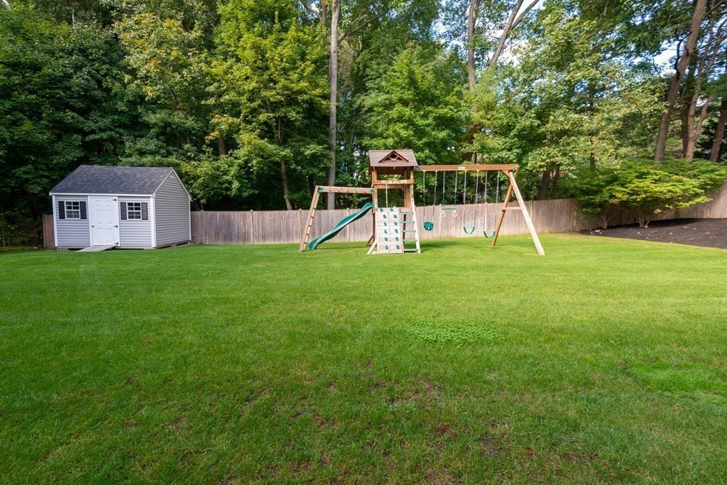 17 Pine Hill Road Lynnfield, MA 01940 - Photo 41 of 42 a view of a house with a backyard
