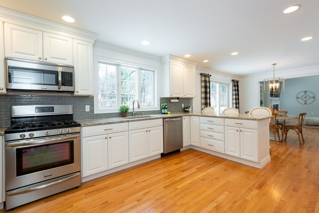 17 Pine Hill Road Lynnfield, MA 01940 - Photo 8 of 42 a kitchen with a stove a sink and a microwave