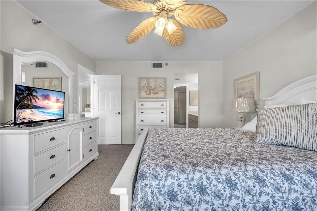 23465 Harbor View Road, Unit 624 Port Charlotte, FL 33980 - Photo 21 of 47 a living room with furniture and a flat screen tv