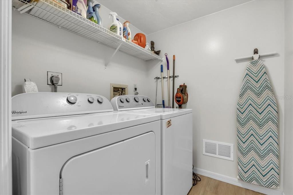 23465 Harbor View Road, Unit 624 Port Charlotte, FL 33980 - Photo 28 of 47 a utility room with dryer and washer