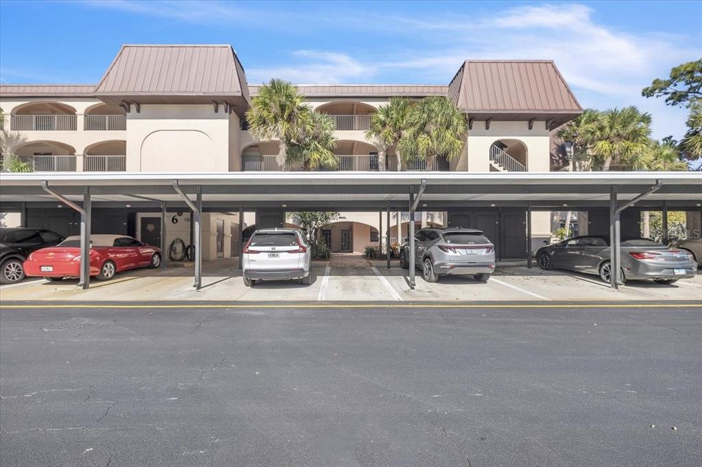 23465 Harbor View Road, Unit 624 Port Charlotte, FL 33980 - Photo 36 of 47 a front view of residential building with cars