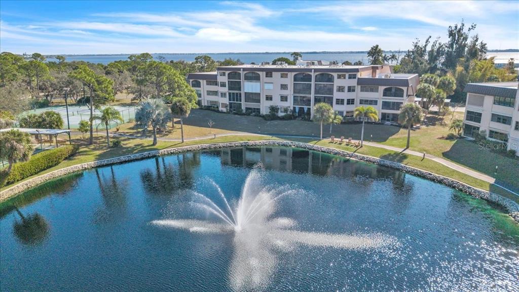 23465 Harbor View Road, Unit 624 Port Charlotte, FL 33980 - Photo 40 of 47 a view of a swimming pool with an outdoor seating