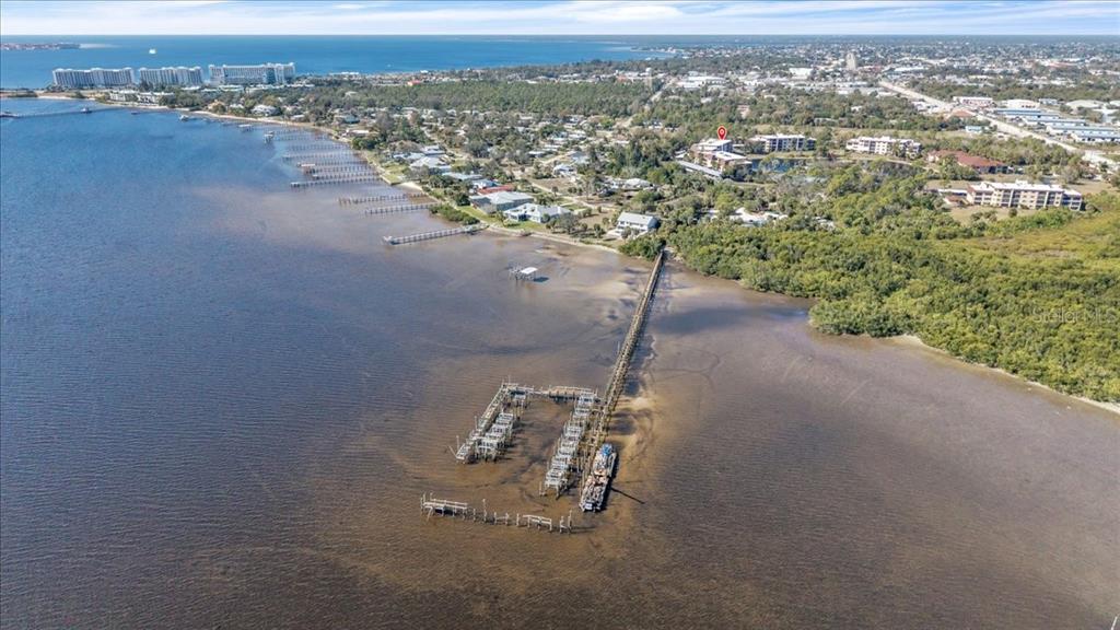 23465 Harbor View Road, Unit 624 Port Charlotte, FL 33980 - Photo 45 of 47 an aerial view of a house with a yard and lake view