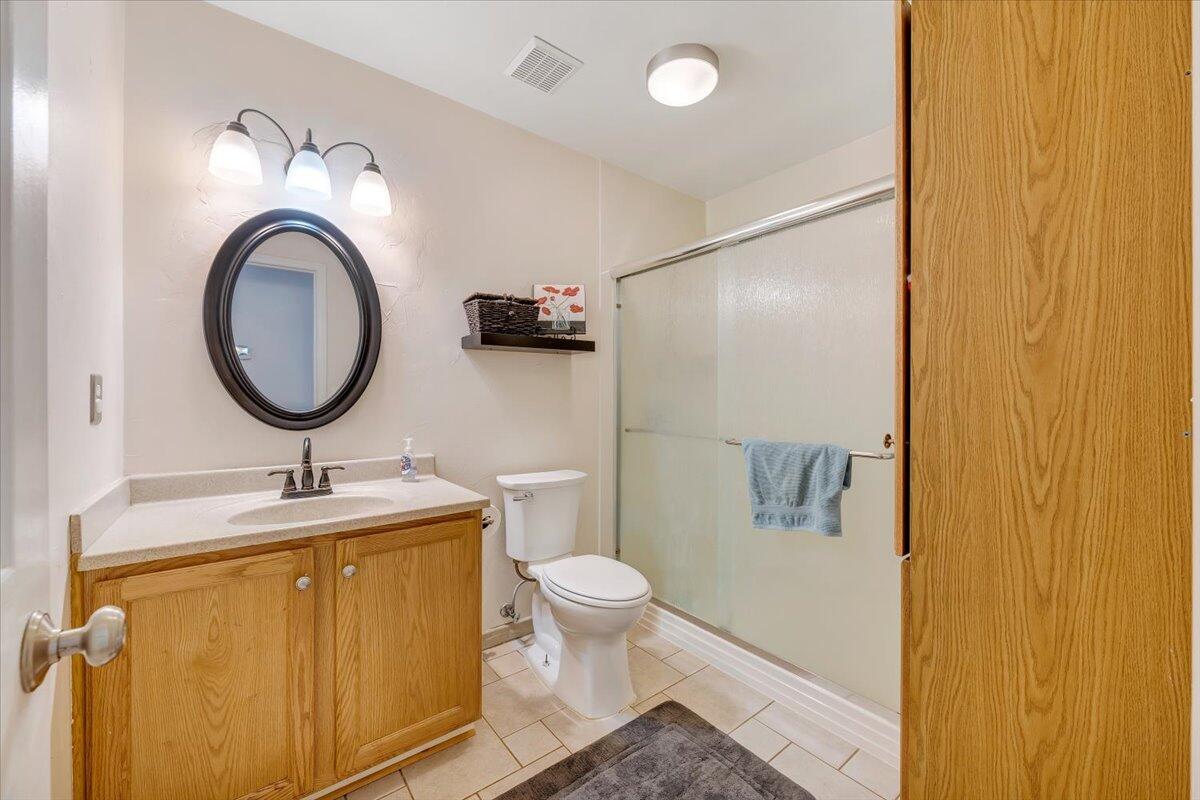 1522 Mountain View Road Vinton, VA 24179 - Photo 14 of 32 a bathroom with a granite countertop toilet sink and mirror