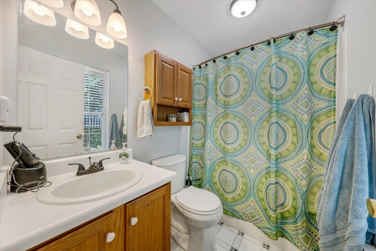 1522 Mountain View Road Vinton, VA 24179 - Photo 16 of 32 a bathroom with a sink vanity mirror and toilet
