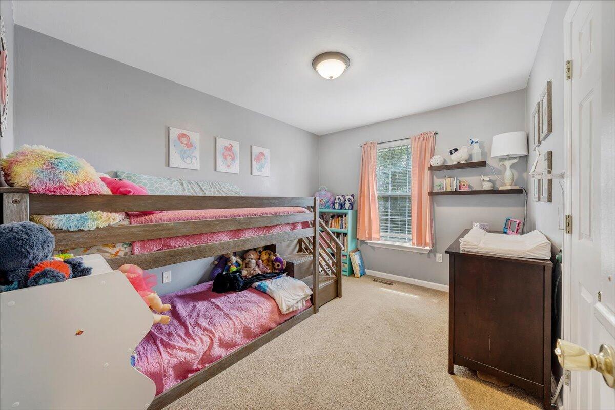 1522 Mountain View Road Vinton, VA 24179 - Photo 17 of 32 a bedroom with a bed and a window