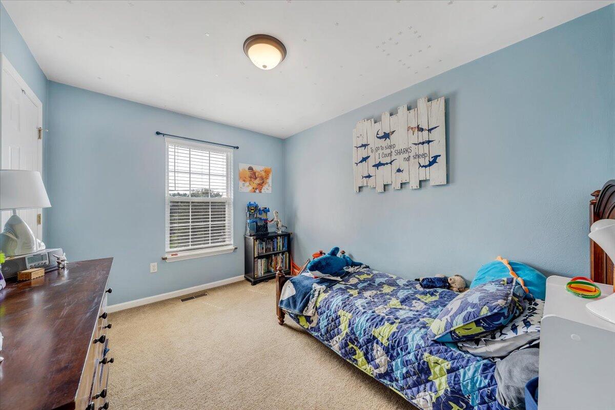 1522 Mountain View Road Vinton, VA 24179 - Photo 18 of 32 a bedroom with bed and a window