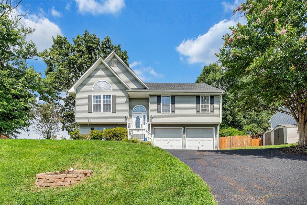 1522 Mountain View Road Vinton, VA 24179 - Photo 2 of 32 a front view of a house with a garden and plants