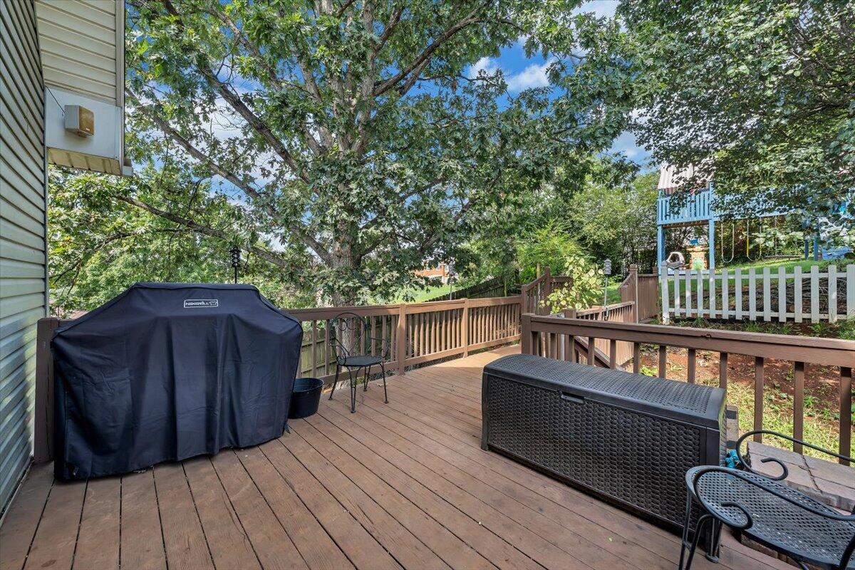 1522 Mountain View Road Vinton, VA 24179 - Photo 25 of 32 a balcony with wooden floor outdoor seating and yard in the back