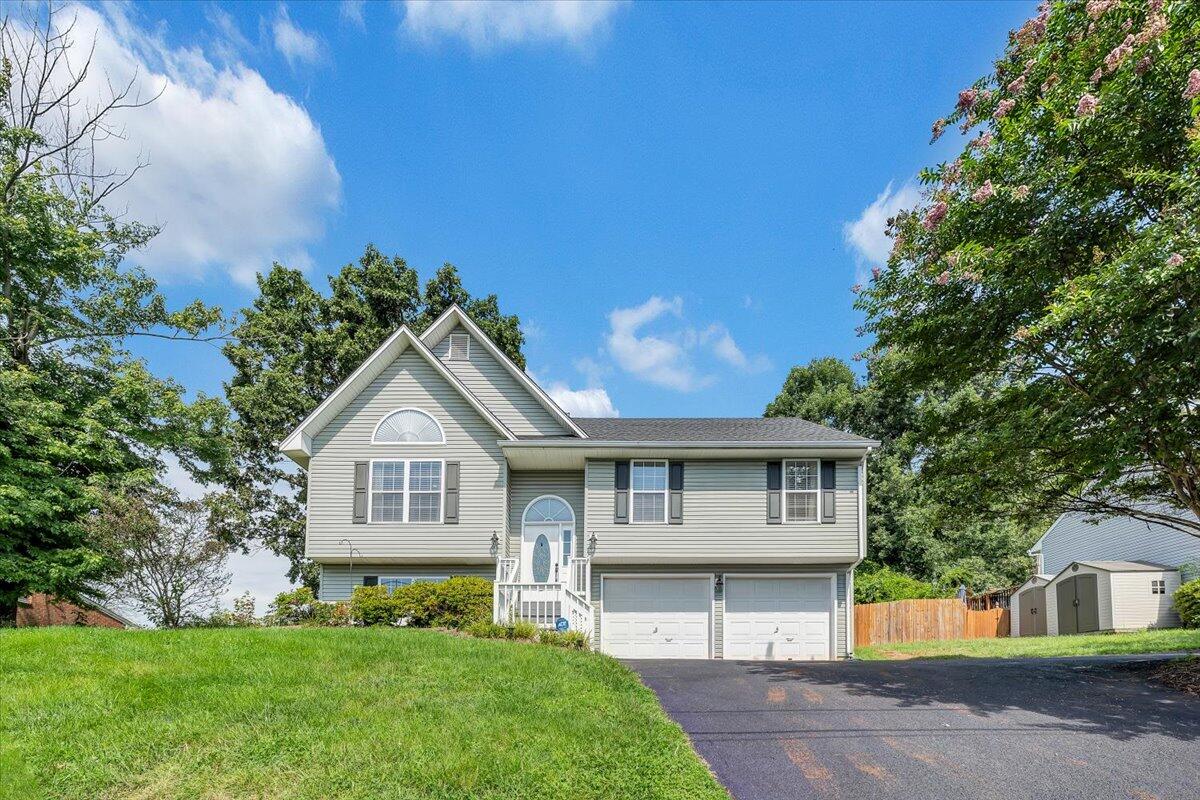 1522 Mountain View Road Vinton, VA 24179 - Photo 30 of 32 a front view of a house with a garden and yard