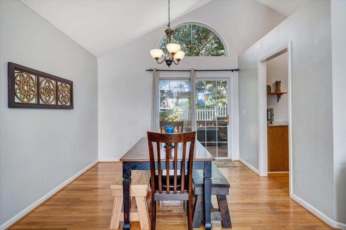 1522 Mountain View Road Vinton, VA 24179 - Photo 8 of 32 a view of a dining room with furniture window and wooden floor