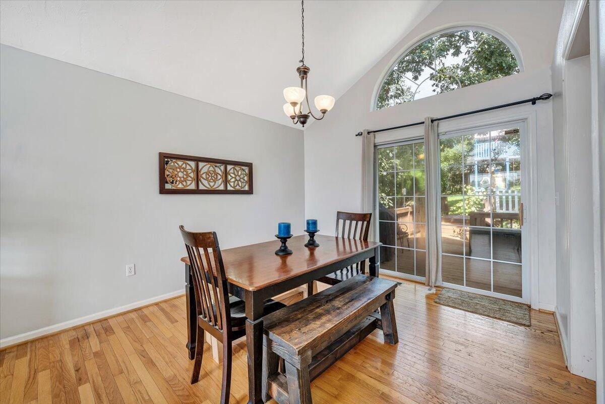 1522 Mountain View Road Vinton, VA 24179 - Photo 9 of 32 a dining room with furniture a chandelier and wooden floor