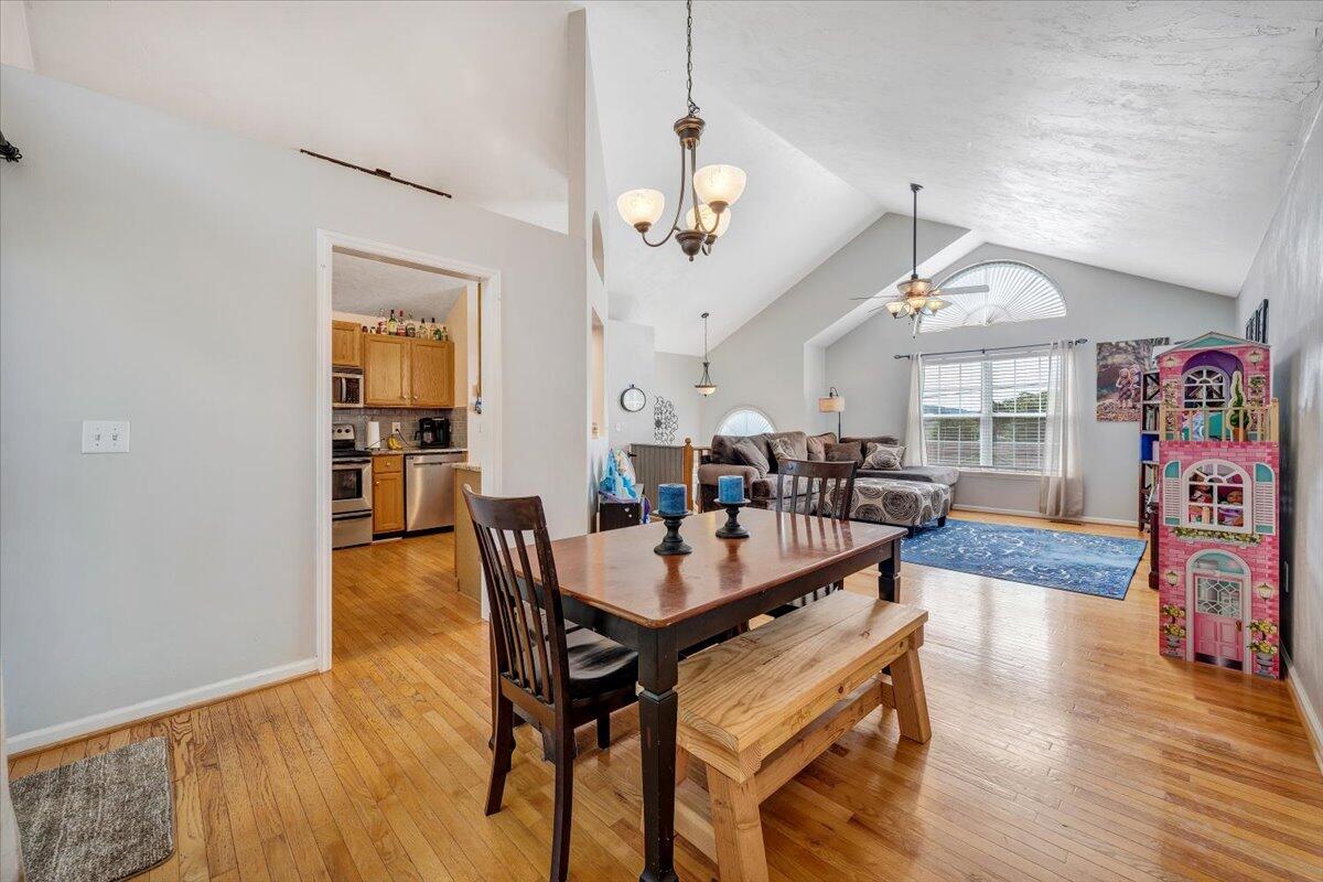 1522 Mountain View Road Vinton, VA 24179 - Photo 10 of 32 a view of a dining room with furniture wooden floor and chandelier