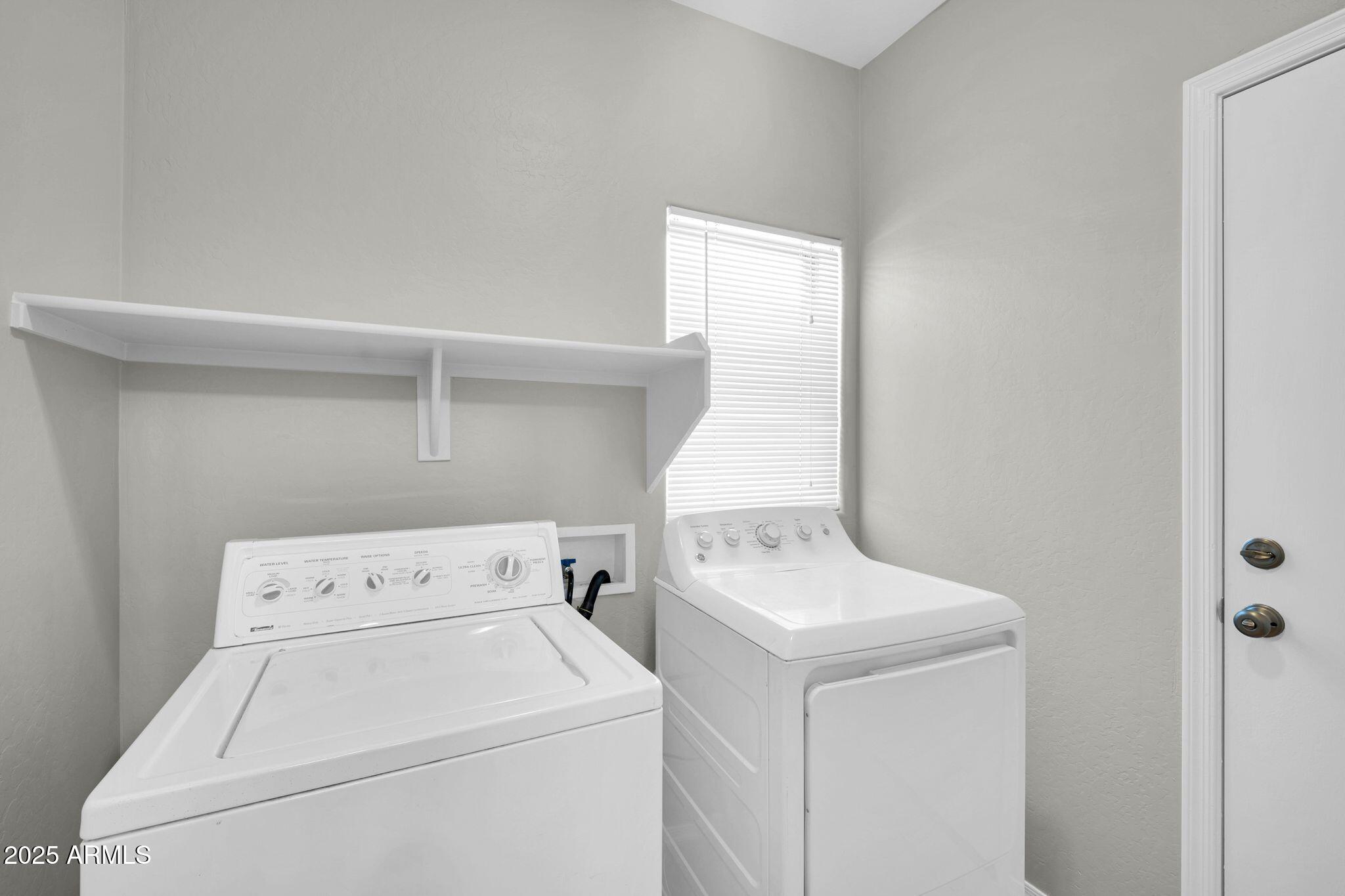 2605 West Darrel Road Phoenix, AZ 85041 - Photo 13 of 33 a utility room with dryer and washer