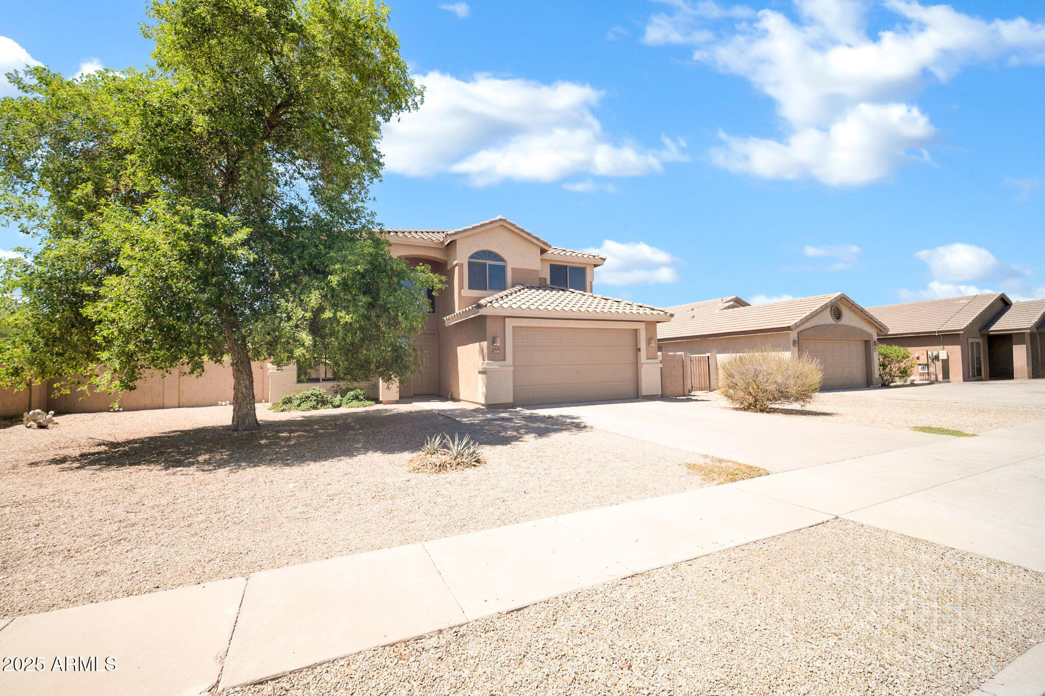 2605 West Darrel Road Phoenix, AZ 85041 - Photo 2 of 33 a front view of a house with a yard