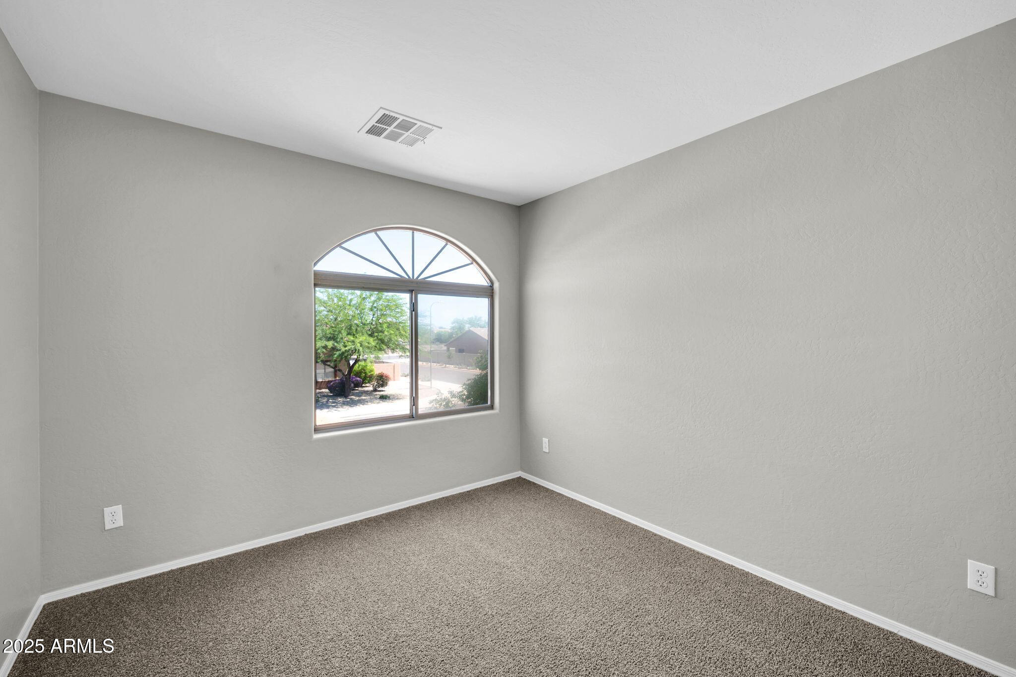 2605 West Darrel Road Phoenix, AZ 85041 - Photo 22 of 33 an empty room with a window