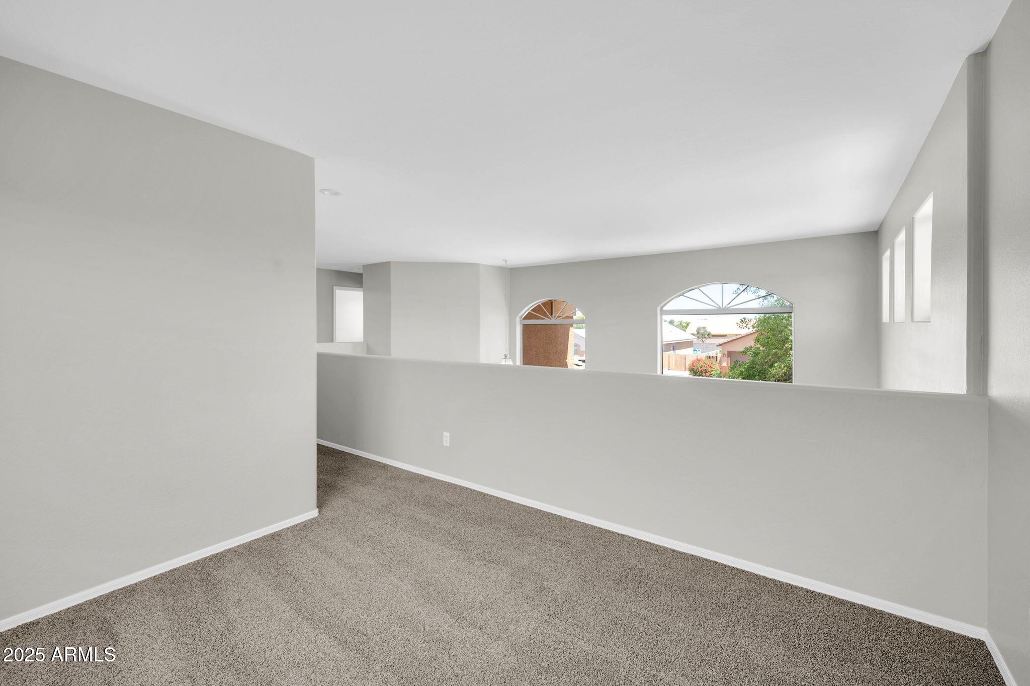 2605 West Darrel Road Phoenix, AZ 85041 - Photo 27 of 33 an empty room with window