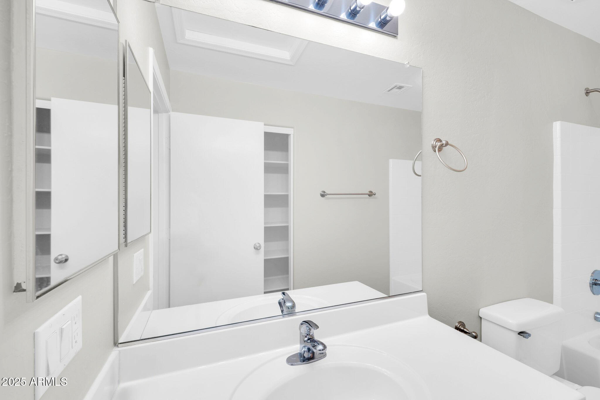 2605 West Darrel Road Phoenix, AZ 85041 - Photo 28 of 33 a bathroom with a granite countertop sink a toilet and shower