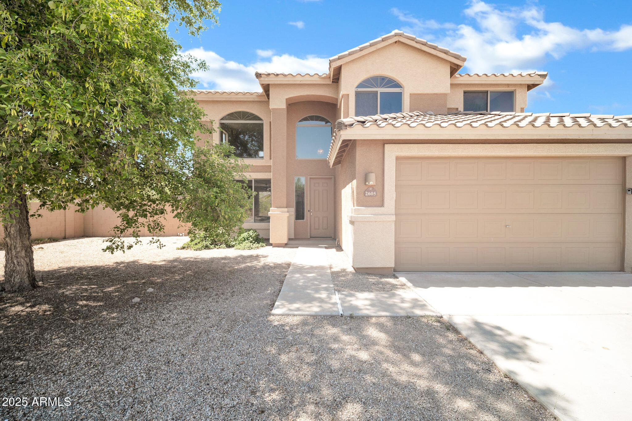 2605 West Darrel Road Phoenix, AZ 85041 - Photo 3 of 33 a front view of a house with a garage