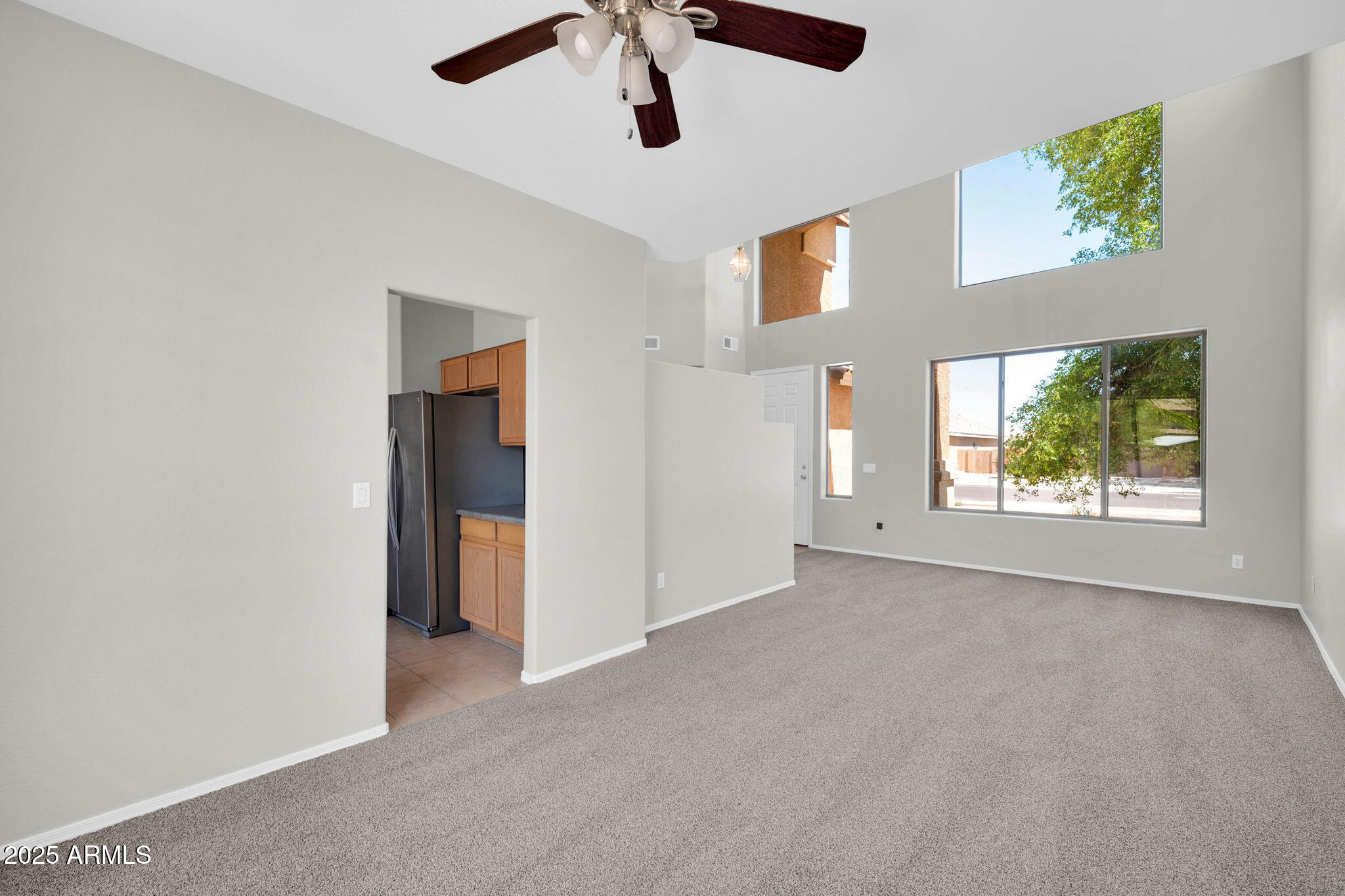 2605 West Darrel Road Phoenix, AZ 85041 - Photo 4 of 33 an empty room with windows and closet