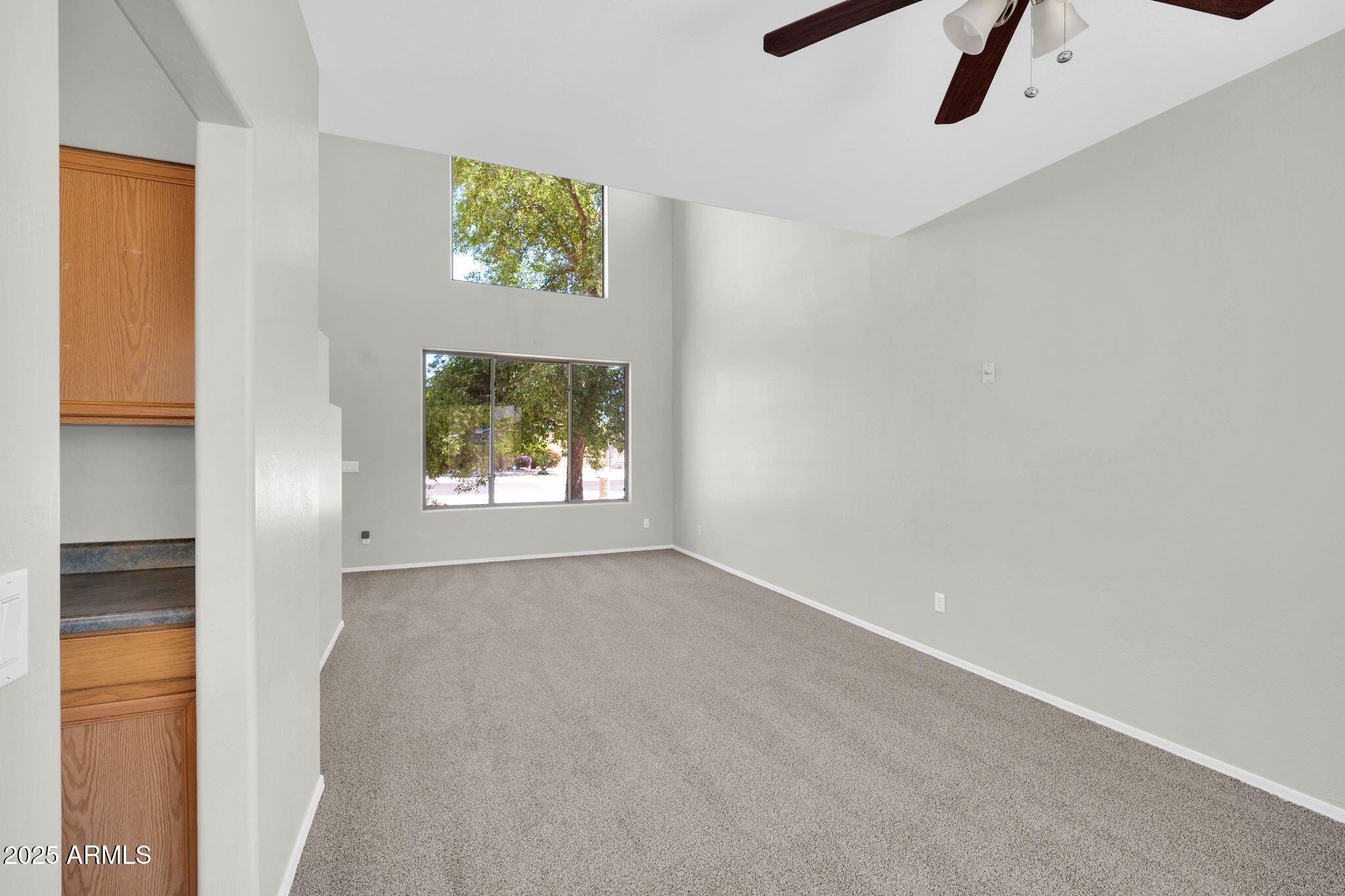2605 West Darrel Road Phoenix, AZ 85041 - Photo 6 of 33 an empty room with windows