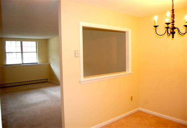 26 Leonard Road, Unit 26 Boxborough, MA 01719 - Photo 5 of 10 a view of an empty room with windows