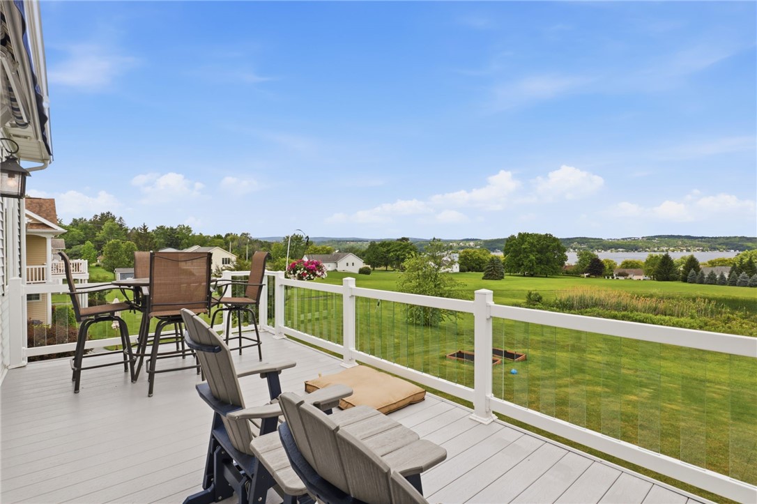 4536 Crystal Ridge Circle Gorham, NY 14424 - Photo 19 of 48 This spacious and beautifully designed upper deck features a high-quality retractable awning, creating a versatile and comfortable environment that serves as an excellent, shaded space for hosting guests, dining alfresco, or enjoying outdoor entertaining throughout the various seasons.