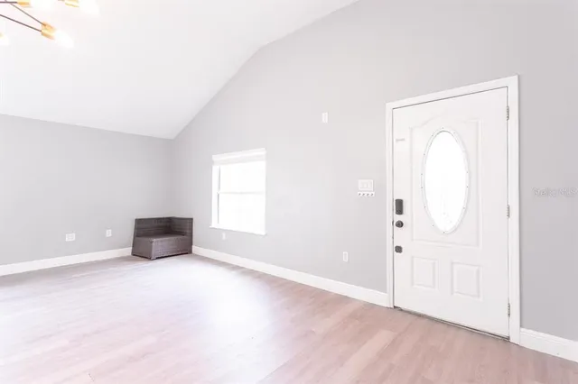 a view of kitchen with livingroom and window