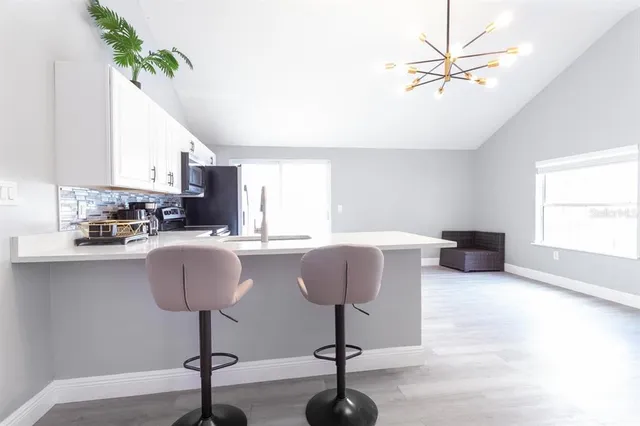 a bedroom with a bed and a night stand