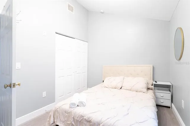 a bathroom with a sink toilet vanity and shower