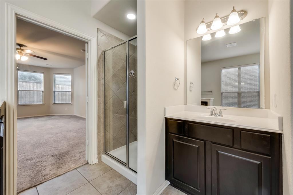 10620 Sexton Drive McKinney, TX 75072 - Photo 9 of 17 a bathroom with a sink and a mirror